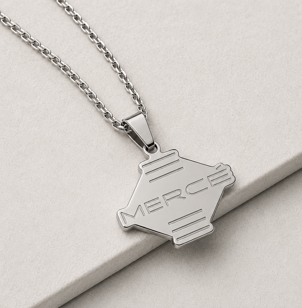  MERCÉ Ligne Pendant lifestyle — silver pendant tabletop still life cinematic