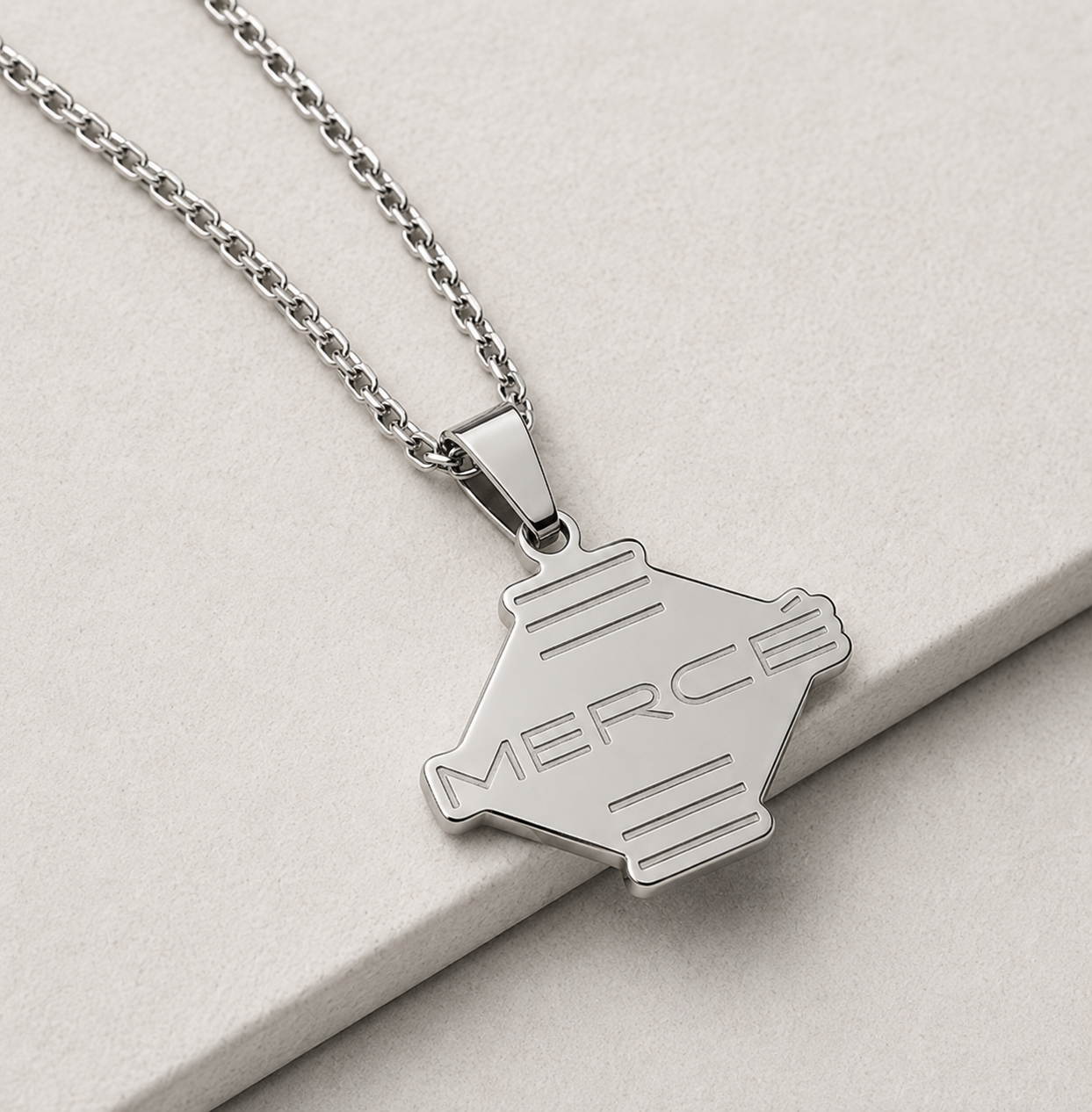  MERCÉ Ligne Pendant lifestyle — silver pendant tabletop still life cinematic