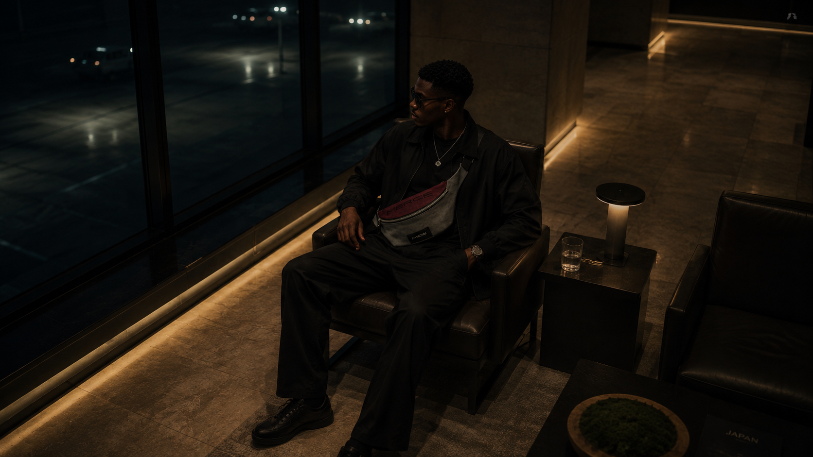 MERCÉ Rouge Sling Pack on model — quiet luxury men's bag cinematic editorial
