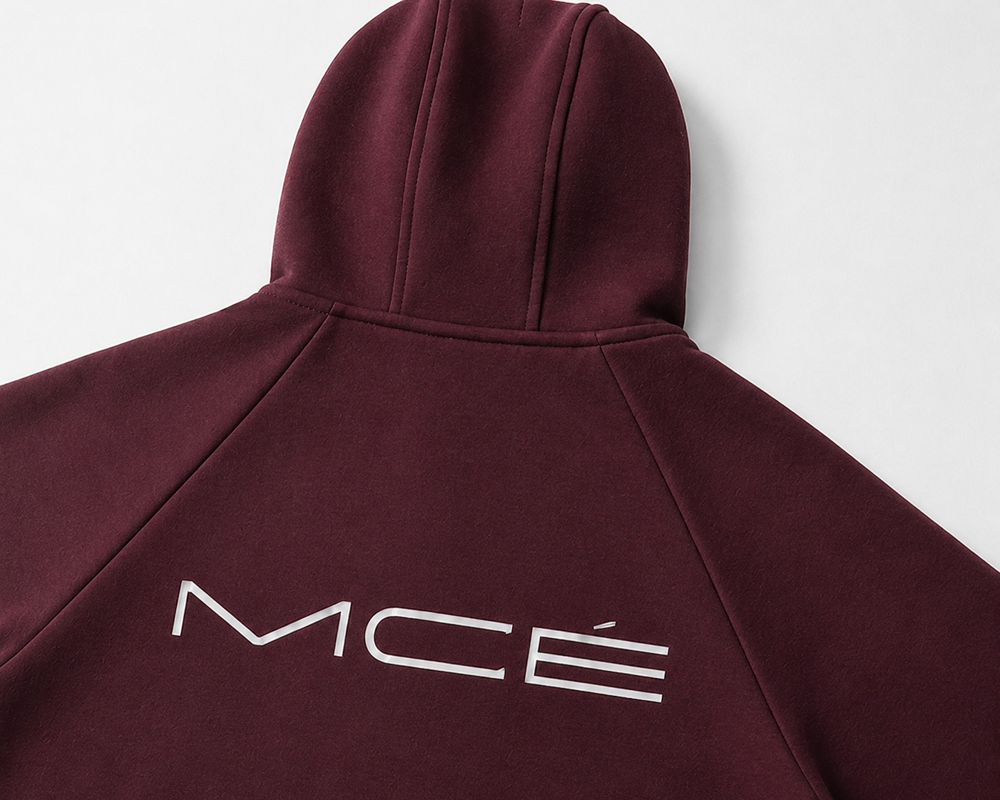 Close-up of MERCÉ heavyweight zip hoodie texture and structured seam detailing
