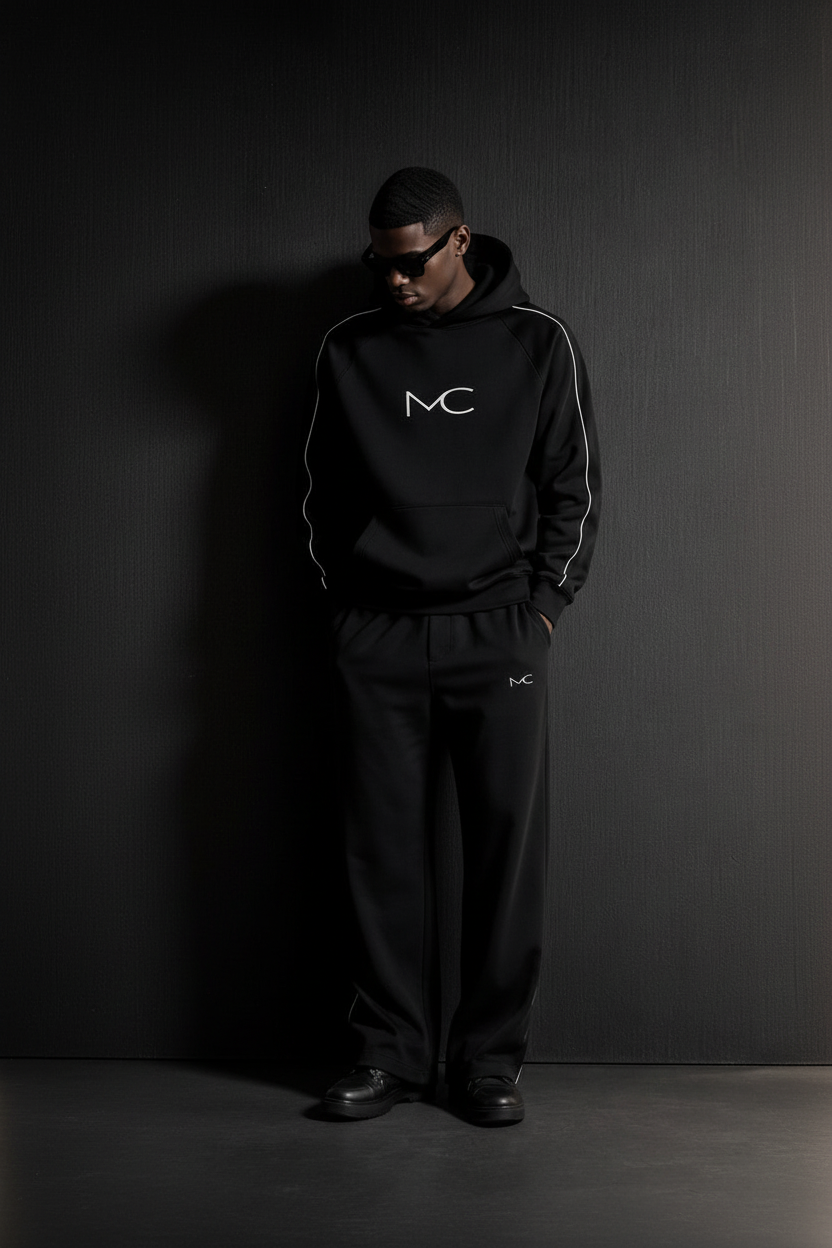 MERCÉ hoodie styled with cinematic architectural lighting