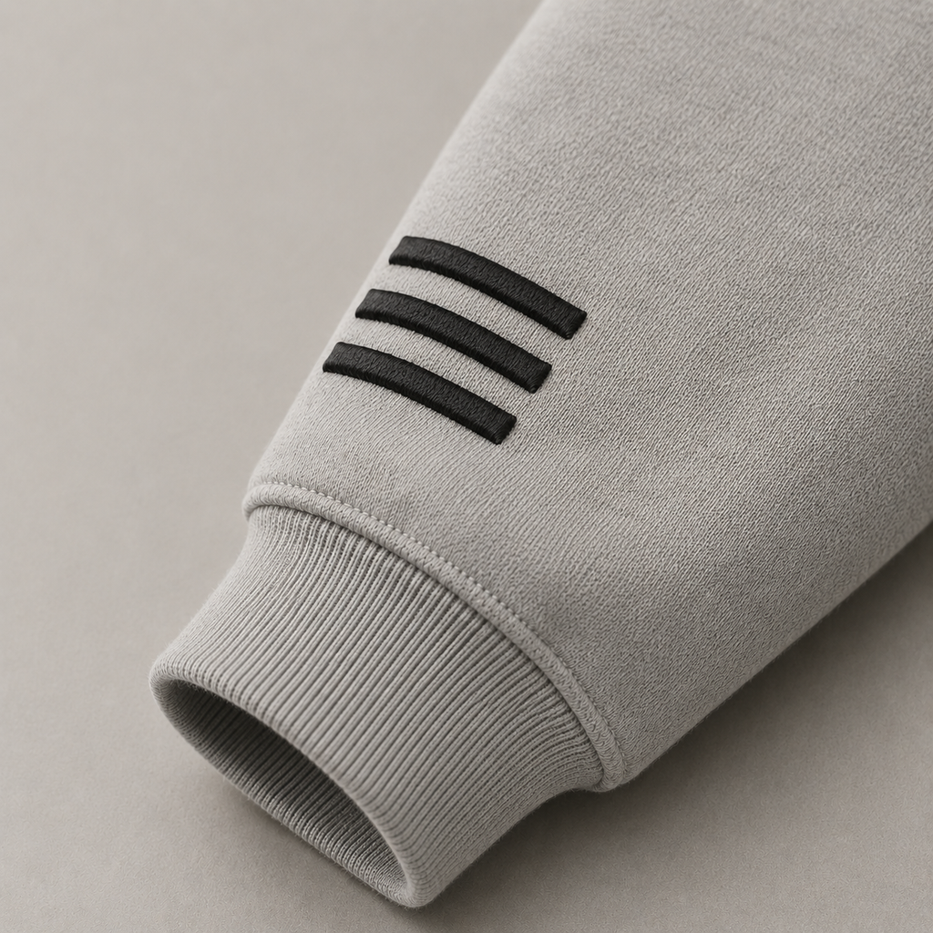 Close-up of MERCÉ Snap Brush Hoodie fabric texture and structured collar detailing