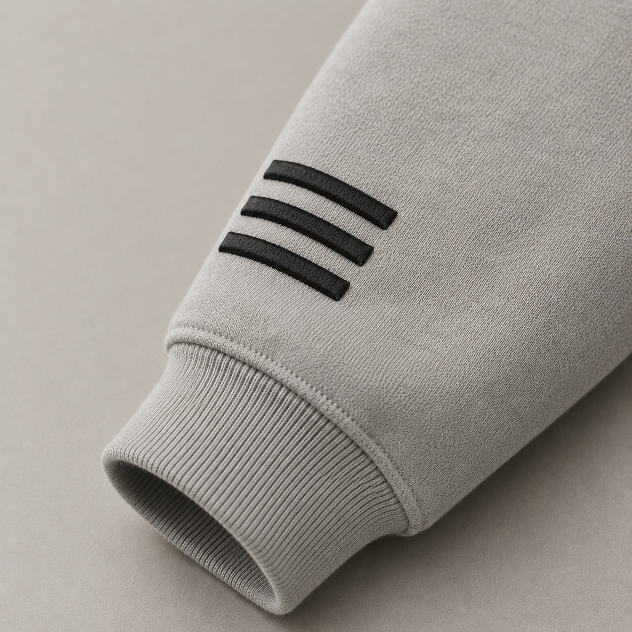 Close-up of MERCÉ Snap Brush Hoodie fabric texture and structured collar detailing