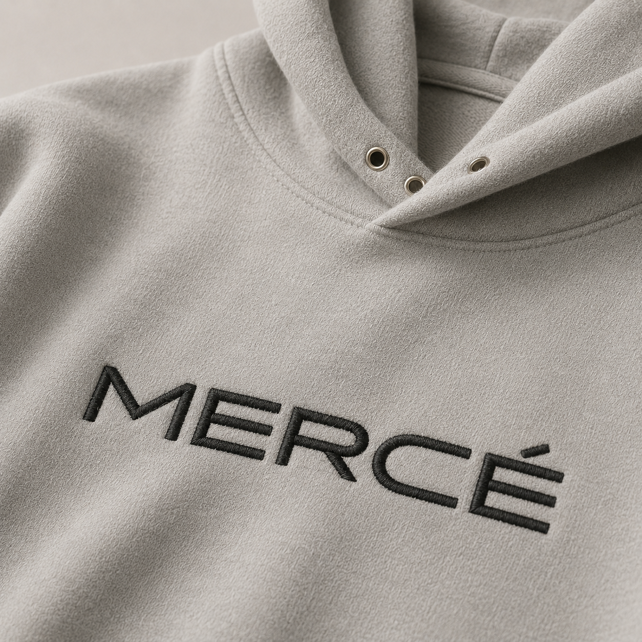 Folded MERCÉ heavyweight hoodie showing brushed cotton construction