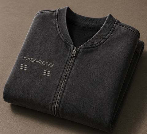 Folded MERCÉ varsity jacket showing structured fleece construction